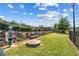 Dog park featuring lush green grass, a seating area, and waste disposal station, perfect for pet owners at 350 Provenance Dr, Atlanta, GA 30328