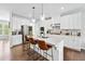 Bright kitchen features white cabinets, stainless appliances, and a center island with bar seating at 350 Provenance Dr, Atlanta, GA 30328
