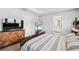 Main bedroom with a large bed, wooden dresser, and adjoining bathroom at 350 Provenance Dr, Atlanta, GA 30328