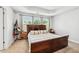 Comfortable main bedroom with tray ceilings and natural light from three windows at 350 Provenance Dr, Atlanta, GA 30328