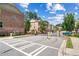 Gated community street view with brick townhomes on a sunny day at 350 Provenance Dr, Atlanta, GA 30328