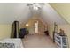 Spacious attic area with carpet and natural light at 418 Whisper Wood Way, Locust Grove, GA 30248
