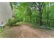 Expansive backyard with mature trees, offering privacy and a natural setting for outdoor activities and relaxation at 418 Whisper Wood Way, Locust Grove, GA 30248