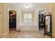 Bathroom with a soaking tub and walk-in closets, offering an elegant space at 418 Whisper Wood Way, Locust Grove, GA 30248