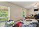 Bedroom with natural light and a ceiling fan provides a cozy, comfortable retreat at 418 Whisper Wood Way, Locust Grove, GA 30248