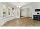 Sunny breakfast nook featuring large windows and a tile floor at 418 Whisper Wood Way, Locust Grove, GA 30248