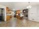 Open kitchen featuring modern stainless steel appliances, a breakfast bar, and lots of cabinet space at 418 Whisper Wood Way, Locust Grove, GA 30248