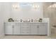 Bright bathroom featuring a double sink vanity with gold hardware, quartz countertop and modern fixtures at 753 Brooke View Drive, Canton, GA 30115