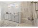 Bright bathroom featuring a dual sink vanity with gold fixtures and a glass enclosed shower at 753 Brooke View Drive, Canton, GA 30115