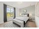 Cozy bedroom featuring a large window, bench, and decorative mirror at 753 Brooke View Drive, Canton, GA 30115