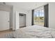 Bedroom with a large window and a closet providing a comfortable living space at 753 Brooke View Drive, Canton, GA 30115