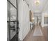 Bright entryway with hardwood floors, a sliding barn door, and contemporary decor at 753 Brooke View Drive, Canton, GA 30115