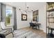 Comfortable home office with a modern chandelier, chic décor, and ample natural light from a large window at 753 Brooke View Drive, Canton, GA 30115