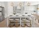 Gourmet kitchen with white cabinets, an island with seating, and stainless appliances at 753 Brooke View Drive, Canton, GA 30115