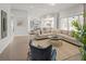 Spacious living room with a modern kitchen, an ample seating, and sliding glass doors at 753 Brooke View Drive, Canton, GA 30115