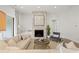 Inviting living room features a stone fireplace, comfortable seating, and sliding glass door at 753 Brooke View Drive, Canton, GA 30115