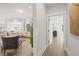 Open-concept living room visible from hallway, showcasing neutral colors, ample seating, and natural light at 753 Brooke View Drive, Canton, GA 30115