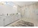 Elegant main bathroom features double vanity sinks, large shower with glass doors, and stylish lighting at 753 Brooke View Drive, Canton, GA 30115