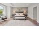 Beautiful main bedroom with a sitting area, soft lighting, and tray ceiling at 753 Brooke View Drive, Canton, GA 30115