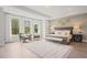 Serene main bedroom features a sitting area, large windows, and stylish decor at 753 Brooke View Drive, Canton, GA 30115