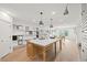 Bright showroom features a large kitchen island, ample lighting, and custom sample displays at 753 Brooke View Drive, Canton, GA 30115