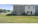 Backyard showing newly installed sod, rear of the home, and some partial privacy fencing at 22 Jacobs Farm Ln # 11, Lawrenceville, GA 30045