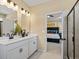 Elegant bathroom with double vanity, white cabinetry, shower and an adjoining bedroom for added convenience at 22 Jacobs Farm Ln # 11, Lawrenceville, GA 30045