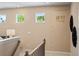 Hallway shot highlighting the home's nine-foot ceilings with a height measuring graphic at 22 Jacobs Farm Ln # 11, Lawrenceville, GA 30045
