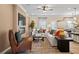 Comfortable living room with a fireplace, hardwood floors, and access to the kitchen at 22 Jacobs Farm Ln # 11, Lawrenceville, GA 30045