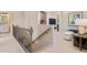 Upstairs loft area with railing, view of a TV nook, and stylish furnishings at 22 Jacobs Farm Ln # 11, Lawrenceville, GA 30045
