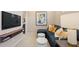 Comfortable upstairs loft area featuring a sectional sofa, stylish decor, and a TV viewing nook at 22 Jacobs Farm Ln # 11, Lawrenceville, GA 30045