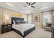 Spacious main bedroom features tray ceiling, large bed, and windows for plenty of natural light at 22 Jacobs Farm Ln # 11, Lawrenceville, GA 30045