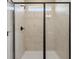 Contemporary shower with a black frame, sleek fixtures, and elegant marble-style tiling at 22 Jacobs Farm Ln # 11, Lawrenceville, GA 30045