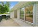 Back porch with grill and sliding glass doors leading into the interior of the home at 3222 Edgemont Way, Decatur, GA 30032