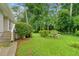 Lush backyard featuring well-maintained landscaping and a serene outdoor seating area at 3222 Edgemont Way, Decatur, GA 30032