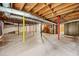 Unfinished basement area with exposed ceiling beams, support posts, and concrete floors at 3222 Edgemont Way, Decatur, GA 30032