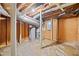 Basement featuring the water heater, concrete flooring, and unfinished walls and ceiling at 3222 Edgemont Way, Decatur, GA 30032