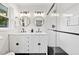 Bathroom featuring double sink vanity, modern fixtures, glass enclosed shower and black/white tile at 3222 Edgemont Way, Decatur, GA 30032