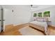 Bright bedroom with hardwood floors, a ceiling fan, and natural light at 3222 Edgemont Way, Decatur, GA 30032