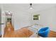 Bright bedroom includes a closet, glass-top desk, hardwood floors, a ceiling fan, and a window at 3222 Edgemont Way, Decatur, GA 30032