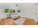Bedroom with hardwood floors, large windows, and natural light at 3222 Edgemont Way, Decatur, GA 30032
