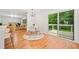 Open dining area features a sliding door to deck, hardwood floors, modern chandelier, and an inviting atmosphere at 3222 Edgemont Way, Decatur, GA 30032