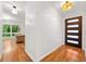 Inviting foyer with a modern front door, hardwood floors and stylish lighting at 3222 Edgemont Way, Decatur, GA 30032