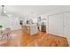 Modern kitchen with an island, stainless steel appliances, white cabinetry, and a dining area, perfect for entertaining at 3222 Edgemont Way, Decatur, GA 30032