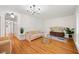 A comfortable living room offers hardwood floors, modern lighting, and neutral-toned furniture at 3222 Edgemont Way, Decatur, GA 30032