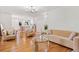 Inviting living room showcasing hardwood floors, modern furniture, and seamless connection to the kitchen at 3222 Edgemont Way, Decatur, GA 30032