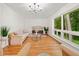 Bright and airy living room featuring hardwood floors, large windows, and stylish decor at 3222 Edgemont Way, Decatur, GA 30032