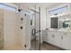 Luxurious bathroom featuring a glass enclosed shower and double sink vanity at 327 Brooke View Trail, Canton, GA 30115