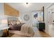 Cozy bedroom featuring a queen-size bed, decorative wall art, and an ensuite bathroom at 327 Brooke View Trail, Canton, GA 30115