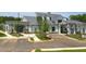 A modern clubhouse with white siding, a metal roof, and ample parking at 327 Brooke View Trail, Canton, GA 30115